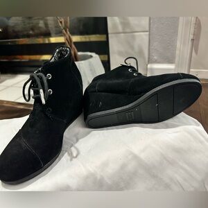 Toms ankle height black suede wedges